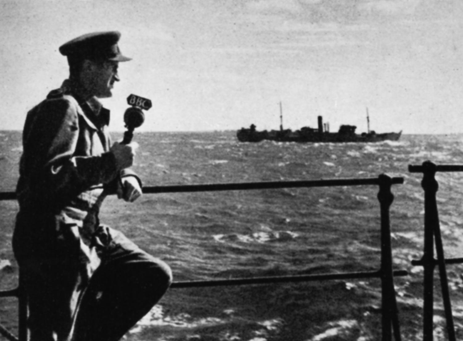 A man on a ship with a microphone